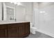 Bathroom with vanity, sink, mirror, and white tiled shower at 8309 Park Cliff Way, Orlando, FL 32836