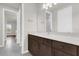 Bathroom vanity with a mirror, sink, and wood cabinets at 8309 Park Cliff Way, Orlando, FL 32836