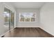 Hardwood bedroom with a sliding glass door and a view of the outdoor swimming pool at 8309 Park Cliff Way, Orlando, FL 32836