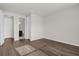 Neutral bedroom featuring hardwood floors and an ensuite bathroom at 8309 Park Cliff Way, Orlando, FL 32836