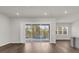 Living Room with sliding doors to patio and a swimming pool, and a large window at 8309 Park Cliff Way, Orlando, FL 32836