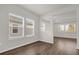 A spacious living room showcasing hardwood floors, and windows for natural light at 8309 Park Cliff Way, Orlando, FL 32836