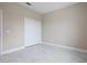 A light, airy bedroom with a double closet and sleek marble-look flooring at 855 S Hancock Dr, Deltona, FL 32725