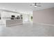 Open-concept living space featuring sleek, marble-look tile floors, recessed lighting, and a modern kitchen with stainless appliances at 855 S Hancock Dr, Deltona, FL 32725