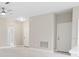 Neutral-toned living area featuring recessed lighting, white doors, and marble-look floors at 855 S Hancock Dr, Deltona, FL 32725