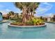 Community lazy river with lush tropical landscaping and a relaxing water feature at 8920 Rhodes St, Kissimmee, FL 34747