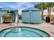A hot tub and shaded cabanas create a relaxing outdoor space by the community pool at 8920 Rhodes St, Kissimmee, FL 34747