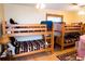 Spacious bedroom featuring wooden bunk beds, perfect for or guests at 9919 Hickory Hollow Rd, Leesburg, FL 34788