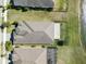 Birds eye view of the backyard with fences and access to water at 113 Azure Mist Way, Daytona Beach, FL 32124