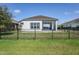 Fenced backyard offering a private outdoor space for entertaining or relaxation at 113 Azure Mist Way, Daytona Beach, FL 32124