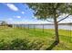 A beautiful view of the lake from this home's fenced backyard at 113 Azure Mist Way, Daytona Beach, FL 32124