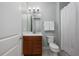 Bathroom features a wood vanity, framed mirror, decorative lighting, and shower with a curtain at 113 Azure Mist Way, Daytona Beach, FL 32124