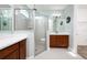 An en-suite bathroom features dual sinks, a large glass shower, and ceramic tile at 113 Azure Mist Way, Daytona Beach, FL 32124