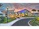 Stunning residents club features a modern architectural design, inviting entrance, and beautiful landscaping at 113 Azure Mist Way, Daytona Beach, FL 32124