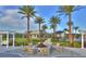 Community fire pit area boasts comfortable seating and lush landscaping at 113 Azure Mist Way, Daytona Beach, FL 32124