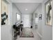 Inviting home foyer with stylish decor, artwork, and tile flooring at 113 Azure Mist Way, Daytona Beach, FL 32124
