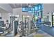 Modern fitness center features state-of-the-art exercise equipment and beautiful windows offering ample lighting at 113 Azure Mist Way, Daytona Beach, FL 32124