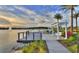 Lakeside view with deck overlooking a water feature and community homes in the background at 113 Azure Mist Way, Daytona Beach, FL 32124