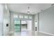 Bright living room boasts tile floors, view of water, and natural light at 113 Azure Mist Way, Daytona Beach, FL 32124