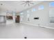 The spacious living room has high ceilings, a fan and large windows for ample natural light at 113 Azure Mist Way, Daytona Beach, FL 32124