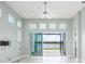 Bright living room boasts tile floors, view of water, and natural light at 113 Azure Mist Way, Daytona Beach, FL 32124