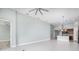 The spacious living room features tile floors, a ceiling fan and lots of natural light at 113 Azure Mist Way, Daytona Beach, FL 32124