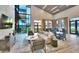 Clubhouse lounge area showcasing modern furniture, natural light, and lake views at 113 Azure Mist Way, Daytona Beach, FL 32124