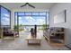 Relaxing outdoor patio with comfortable seating and a picturesque view of the lake at 113 Azure Mist Way, Daytona Beach, FL 32124