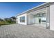 Enjoy this home's patio with stone pavers and covered area with ceiling fan, great for entertaining at 113 Azure Mist Way, Daytona Beach, FL 32124