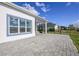Rear patio with stone pavers, perfect for entertaining or relaxing outdoors at 113 Azure Mist Way, Daytona Beach, FL 32124