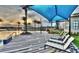 Resort-style pool area featuring lounge chairs and a shaded structure at sunset at 113 Azure Mist Way, Daytona Beach, FL 32124
