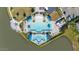 Aerial shot of community pool featuring cabanas, lounge chairs, and tropical landscaping at 113 Azure Mist Way, Daytona Beach, FL 32124