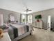 Bright bedroom features a ceiling fan, TV, and matching dressers at 1144 Legg Dr, Apopka, FL 32712