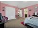 Comfortable bedroom featuring a large closet and an adjoining bathroom entrance at 1144 Legg Dr, Apopka, FL 32712