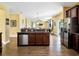 Open kitchen with stainless steel appliances, wooden cabinets, and spacious center island at 1144 Legg Dr, Apopka, FL 32712