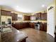 Modern kitchen with stainless steel appliances, dark wood cabinetry, and granite countertops at 1144 Legg Dr, Apopka, FL 32712
