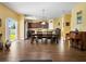 Open-concept kitchen and dining area featuring stainless steel appliances and a large dining table at 1144 Legg Dr, Apopka, FL 32712