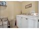 Practical laundry area equipped with washer, dryer, and storage solutions at 1144 Legg Dr, Apopka, FL 32712