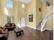Inviting living room with high ceilings, beautiful floors, and staircase access at 1144 Legg Dr, Apopka, FL 32712