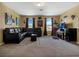 Bright living room featuring a leather sectional, home theater, and natural light at 1144 Legg Dr, Apopka, FL 32712
