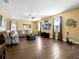 Bright and airy living room with a ceiling fan, wood floors and lots of natural light at 1144 Legg Dr, Apopka, FL 32712
