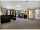 Expansive living room boasts large windows, neutral walls, and flexible layout at 1144 Legg Dr, Apopka, FL 32712