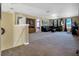 Spacious living room with plush leather sectional and large windows at 1144 Legg Dr, Apopka, FL 32712
