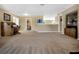 Open loft area perfect for office or play, with neutral carpet and ample light at 1144 Legg Dr, Apopka, FL 32712