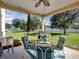 Inviting outdoor patio with ample seating, grill, and backyard views at 1144 Legg Dr, Apopka, FL 32712