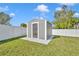 Back yard storage shed on a well-maintained lawn, providing extra space for tools and equipment at 116 Alcala Dr, Kissimmee, FL 34758