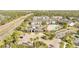 An aerial view displays a community with a clubhouse, pool, and lush landscaping at 11901 Sandy Knoll Ct # 814, Orlando, FL 32825