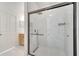 Bathroom featuring a glass shower door, rain shower head, tile surround, and modern fixtures at 11901 Sandy Knoll Ct # 814, Orlando, FL 32825