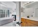 Bathroom featuring a light wood vanity paired with the primary bedroom at 11901 Sandy Knoll Ct # 814, Orlando, FL 32825