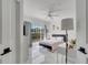 Bright bedroom features marble floors, ceiling fan and view of outdoor greenery at 11901 Sandy Knoll Ct # 814, Orlando, FL 32825